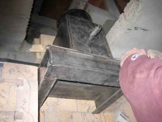 Seating the flue damper assembly in line with the chimney